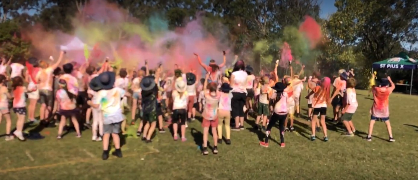 Students participating in a colour run, highlighting fun, inclusion and school community spirit